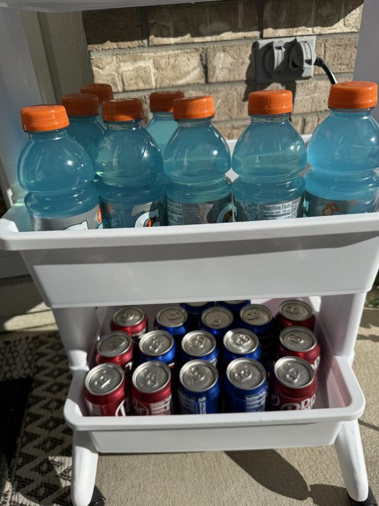 rolling cart containing drinks and snacks